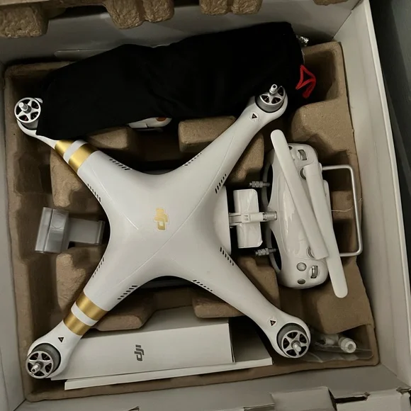 DJI White and Gold Drone with Controller